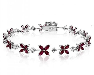 Bracelet with ruby and diamond stations exhibiting a floral pattern