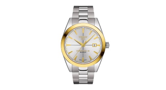 A Tissot watch with silver strap and dial and gold bezel, indices, and hands