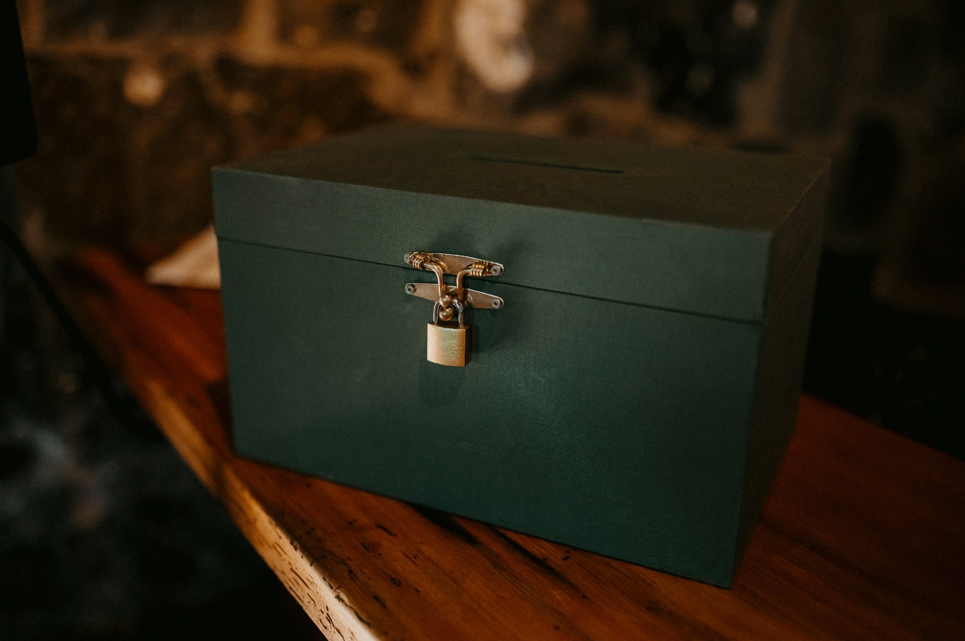 a green box with a small padlock keeping it closed