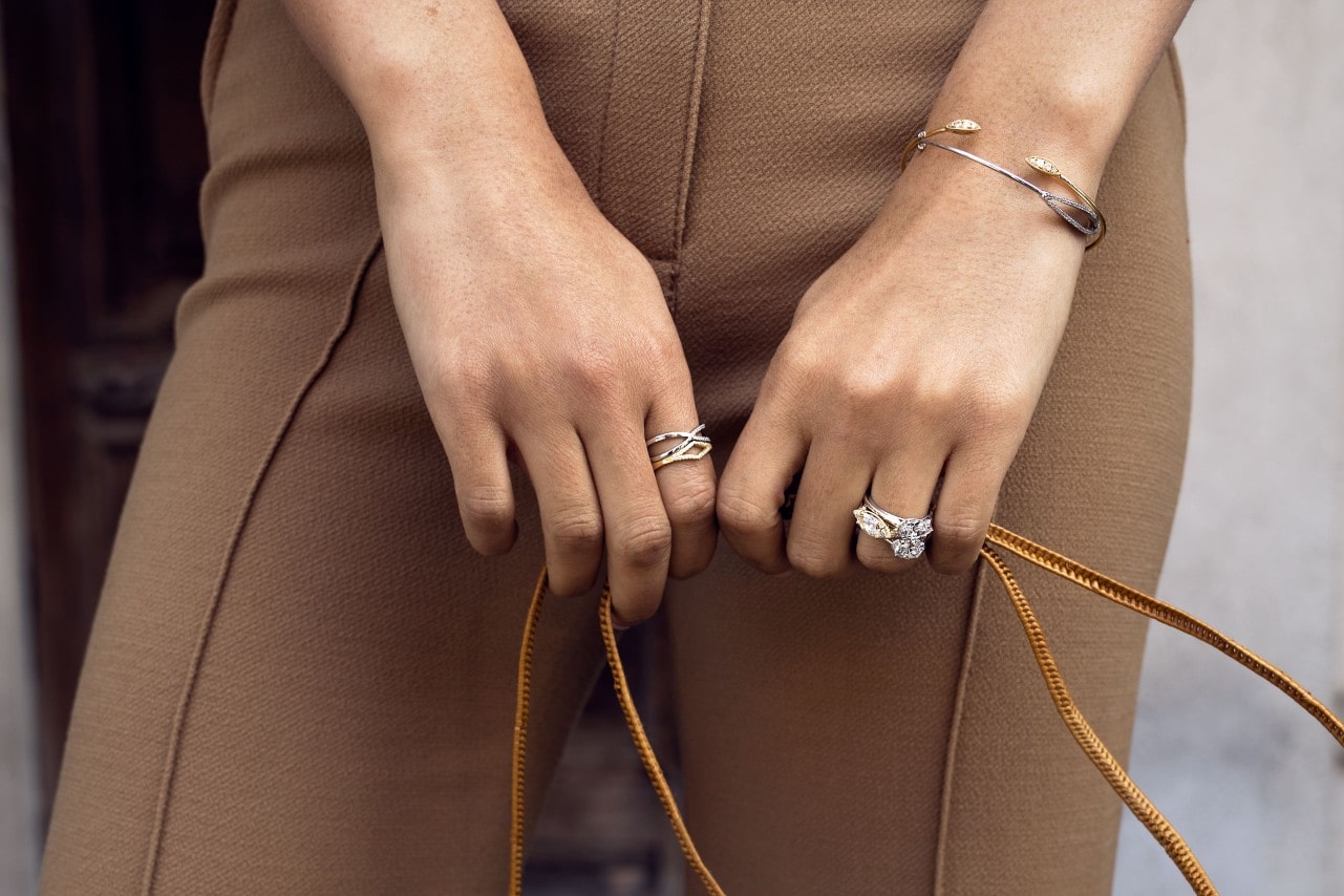 a lady’s hands wearing TACORI jewelry