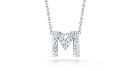 A white gold “M” pendant necklace studded with diamonds from Roberto Coin, available at BENARI JEWELERS.